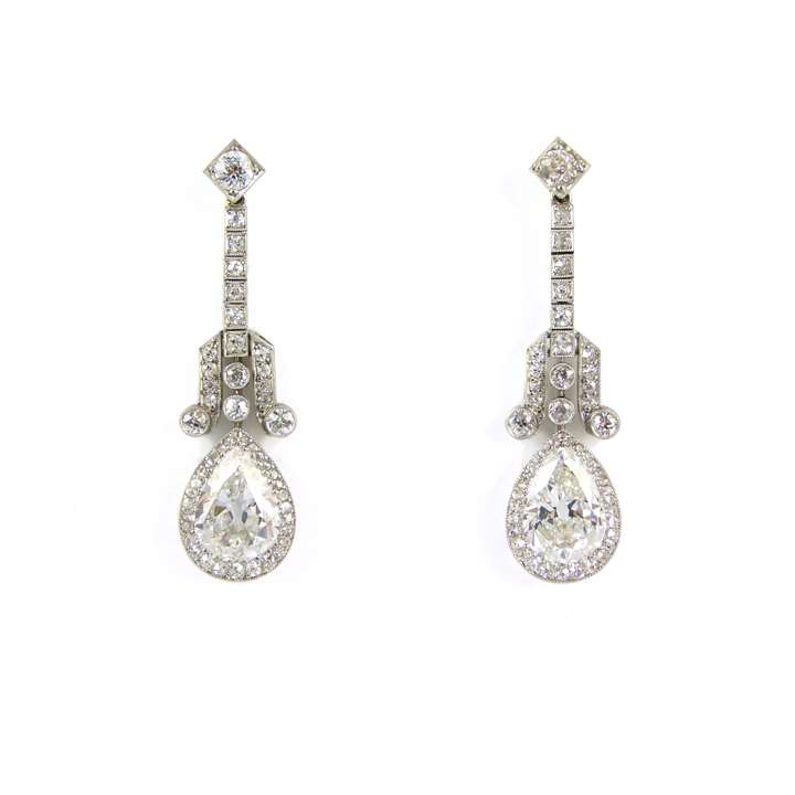 Pair of Art Deco pear shaped diamond cluster pendant earrings